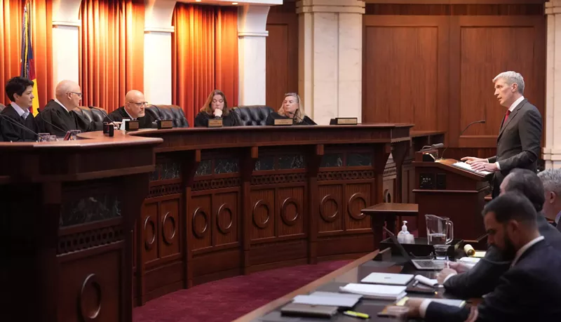 Image: Attorney Eric Olson, far right, argues before the Colorado Supreme Court on Wednesday in Denver.