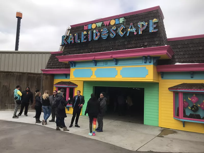 Image: Artists who worked on Kaleidoscape hobnob in front of the ride.