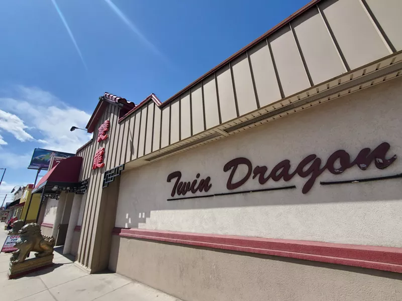 Image: the outside of a building with a sign that says Twin Dragon