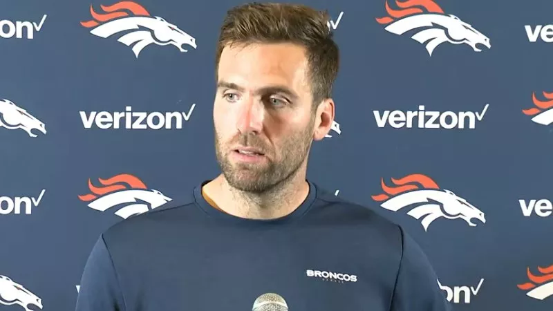 Image: Quarterback Joe Flacco meets the press after the Denver Broncos' first win of the season.