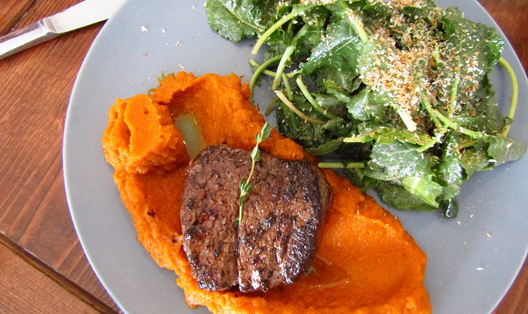 Coffee-rubbed beef tenderloin with sweet potatoes and a baby kale salad. - MARK ANTONATION