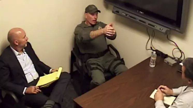 During his post-shooting interview, Officer Jeffrey Motz can be seen demonstrating a two-handed stance while describing his fatal encounter with suspect Dion Damon. - HOLLAND, HOILLAND EDWARDS & GROSSMAN/KILLMER, LANE & NEWMAN LLP