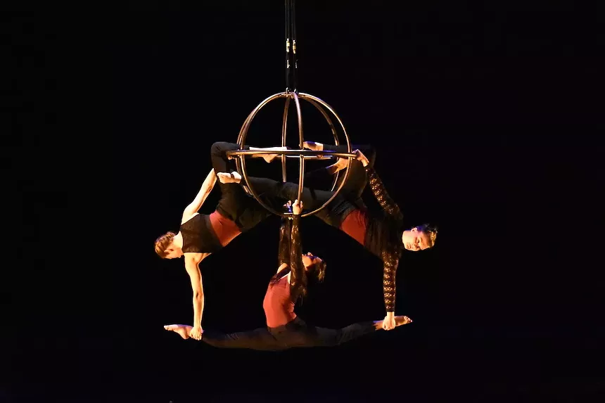 Angela Folz, Maya Muenzer and Sarah Harrison execute a high-flying move, in Flight Path. - COURTESY OF FREQUENT FLYERS® AERIAL DANCE