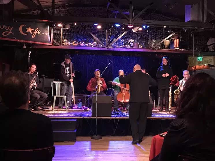 Steven Gordon (standing up with a homemade bass) and friends soundpainting at the American Gothic 2017 benefit concert. - SUSAN FROYD