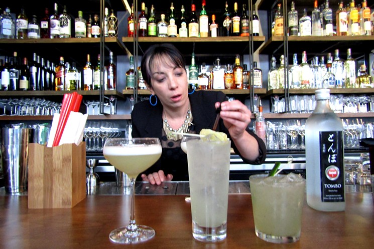 Co-owner Jen Mattioni puts the finishing touches on some house cocktails. - MARK ANTONATION