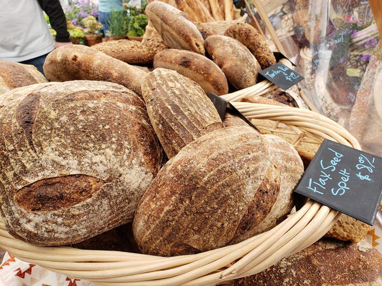 Loaves of bread by Raleigh Street Bakery being sold at the Union Station Farmers' Market. - LINNEA COVINGTON