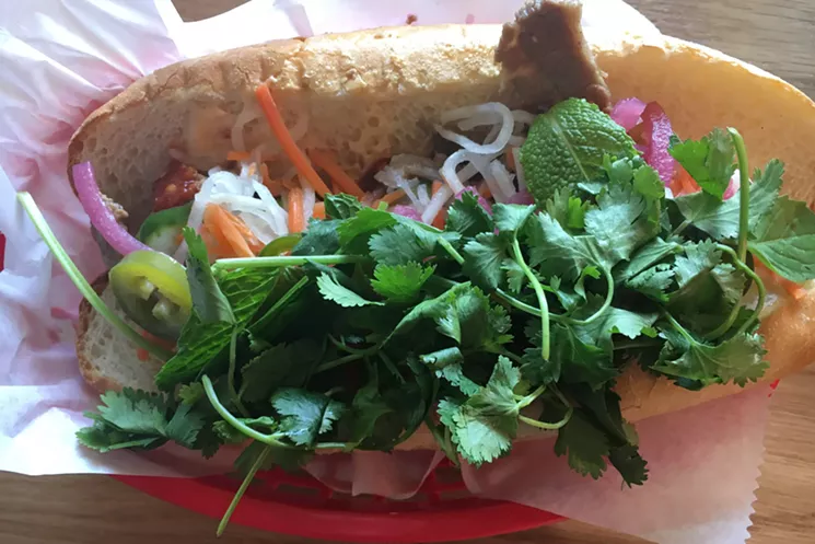 There's actually a pretty healthy portion of brisket under those fresh herbs and pickled veggies. - MARK ANTONATION