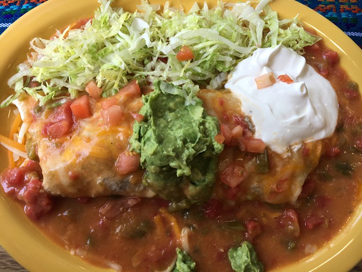 A barbacoa burrito smothered in green chile will be familiar to northwest Denver neighbors. - MARK ANTONATION
