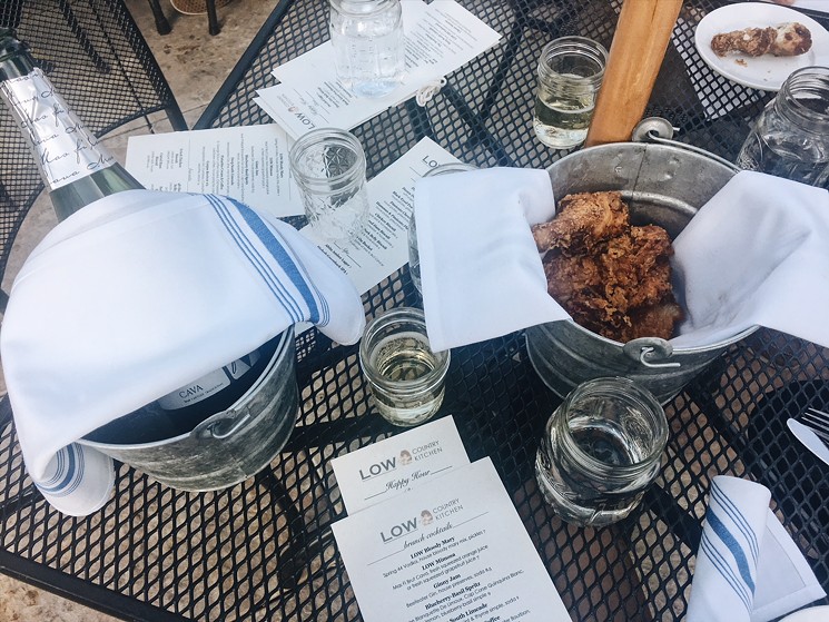Low Country's compelling offer: five pieces of fried chicken and bubbles on a patio. - LAURA SHUNK