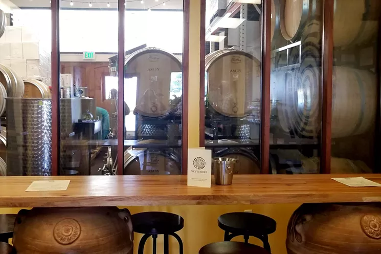 The wine-making room at Settembre is behind glass to help control the temperature and humidity. - KRISTA KAFER