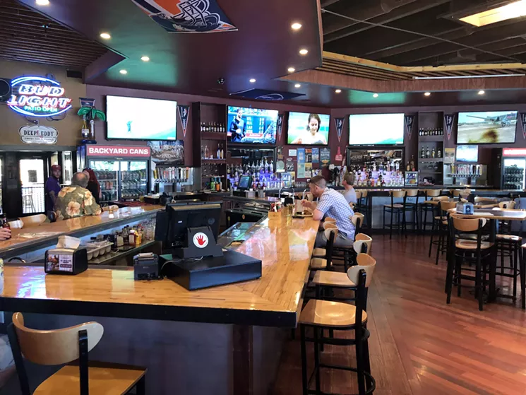 The irregularly shaped bar at Gibby's offers plenty of vantage points for watching televised sports. - SARAH MCGILL
