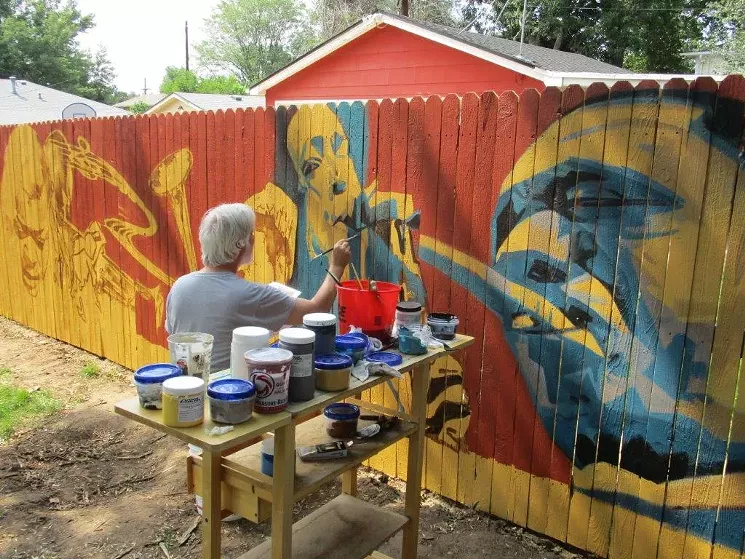 One July morning in Englewood, artist Peter Hurley brings tenor-sax player Charlie Parker to life, as the dynamic John Coltrane looks on. - BOB KAHN