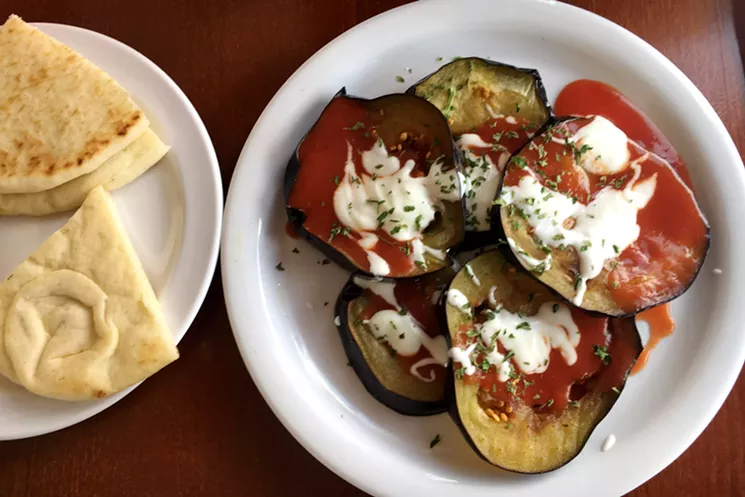 Grilled eggplant is served as an appetizer or in a veggie sandwich with falafel and stuffed grape leaves. - MARK ANTONATION