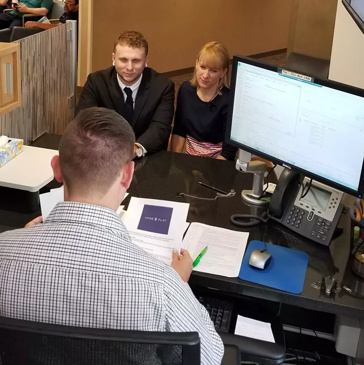 Taylor Rosean and his mother, Megan Lumpkins, submit their application for a Cannabis Consumption Establishment license on June 7. - COURTESY OF DENVER VAPE AND PLAY