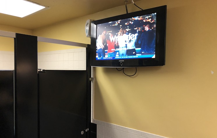No need to worry about missing the game in the women's restroom at Challengers. - SARAH MCGILL