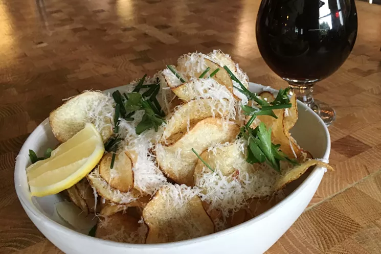 Potato chips get a drizzle of brown butter before being served. New Belgium's La Folie makes a good accompaniment. - MARK ANTONATION