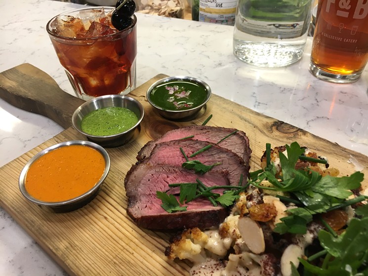 Wood-roasted beef sirloin with three sauces, charred cauliflower and a black Manhattan from the bar. - MARK ANTONATION
