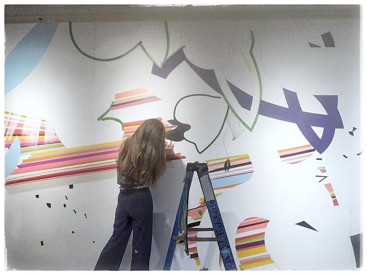 Aell creates an indoor mural for the Arvada Center's In Sight On Site exhibition. - COURTESY OF SABIN AELL