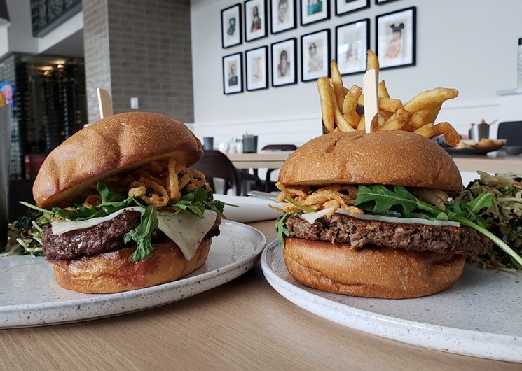 Narrative's dry-aged beef burger next to the Impossible Burger. - LINNEA COVINGTON