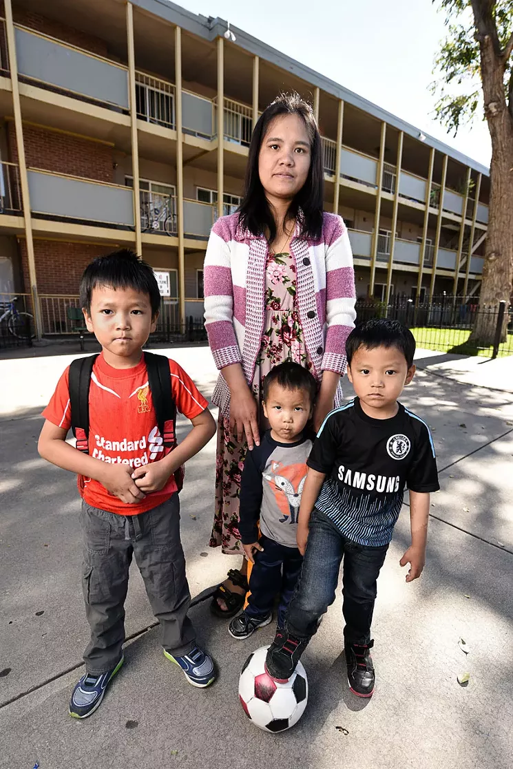 Li Ling relies on workers’ compensation benefits to continue living in her Aurora apartment. - ANTHONY CAMERA