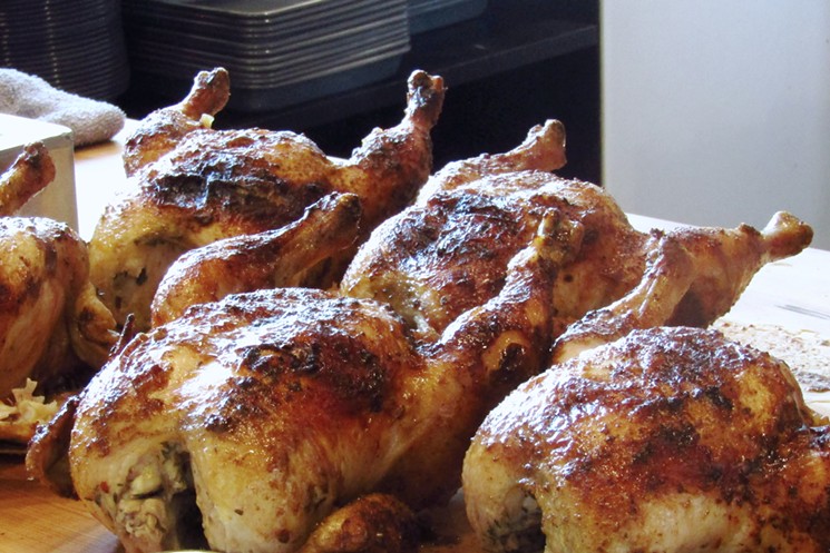 Roast chickens hot off the rotisserie. - MARK ANTONATION