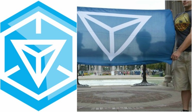 The Ingress logo, left, and a flag bearing the Identity Evropa logo displayed at Civic Center Park at an event this summer. - GOOGLE PLUS/FILE PHOTO