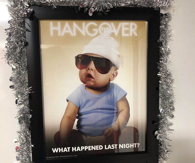 This poster in the bathroom is the perfect combination of Hangover movie memorabilia and holiday cheer. - SARAH MCGILL