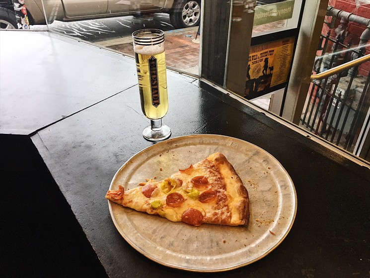 Grab a slice (or whole pizza) and a beer at Hops & Pie. - LAURA SHUNK