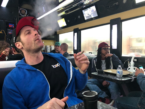 Loopr co-founder Hal Taback rides one of his buses through the Denver metro area. - EMILY MCCARTER