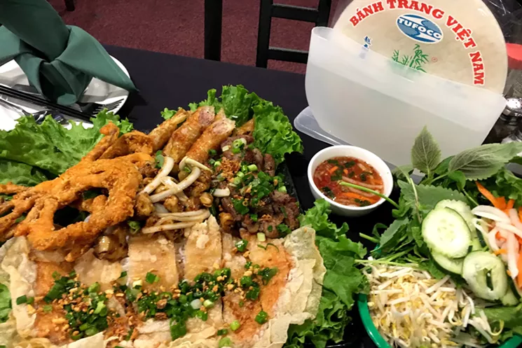 The house spring roll platter, with fried soft shell crab, fried shrimp paste, egg rolls, pork skewers and other ingredients you can wrap with rice paper. - MARK ANTONATION