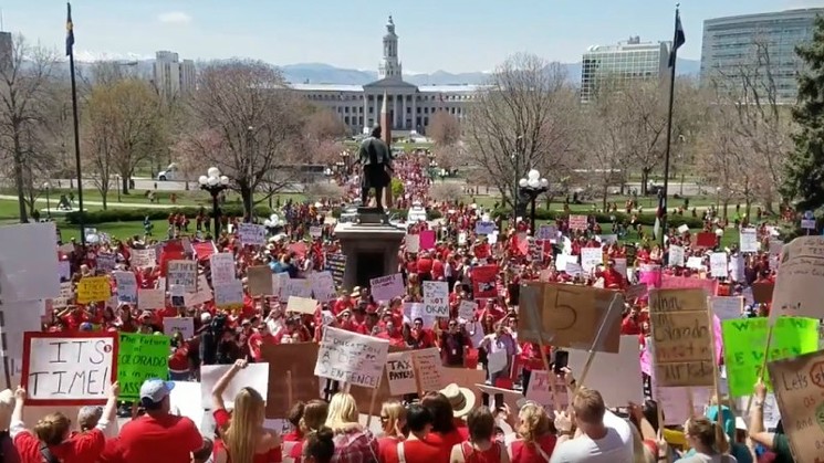 Teachers chanted "Not enough" during a rally at the State Capitol last April. - YOUTUBE