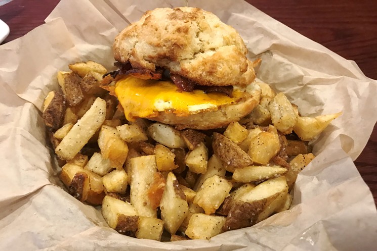 A breakfast biscuit sandwich with potatoes. - BRIDGET WOOD