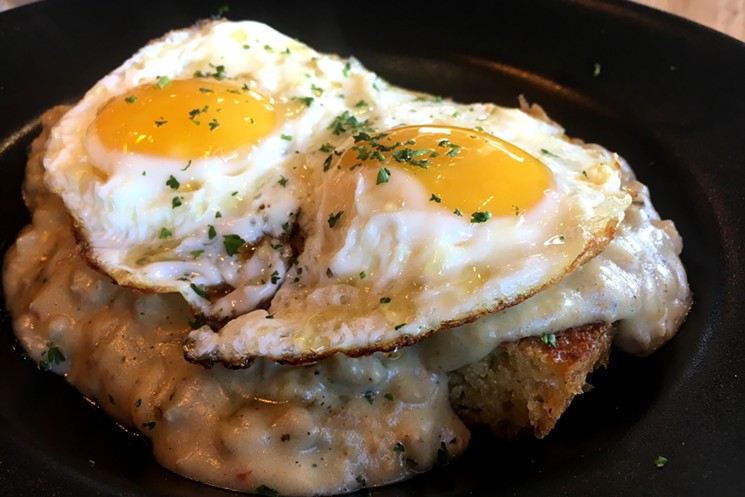 Buttermilk biscuits, sausage gravy and fried eggs. - MARK ANTONATION