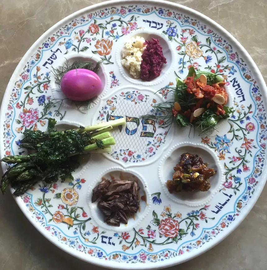 A traditional seder plate holds a shank bone, egg, vegetable, bitter herbs and charoset. - COURTESY OF SAFTA