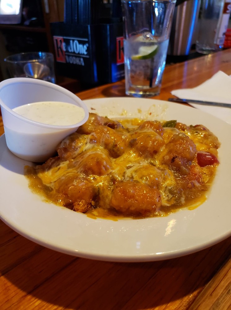 Tots smothered in the housemade green chile and cheese? Yes, please! - SAMANTHA MORSE