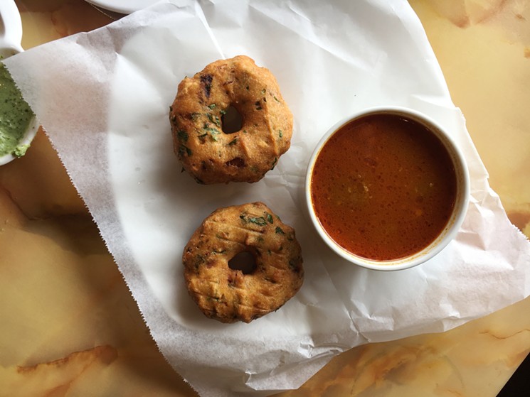Doughnut-shaped vada are great when dunked in the spicy side of sambhar. - MARK ANTONATION