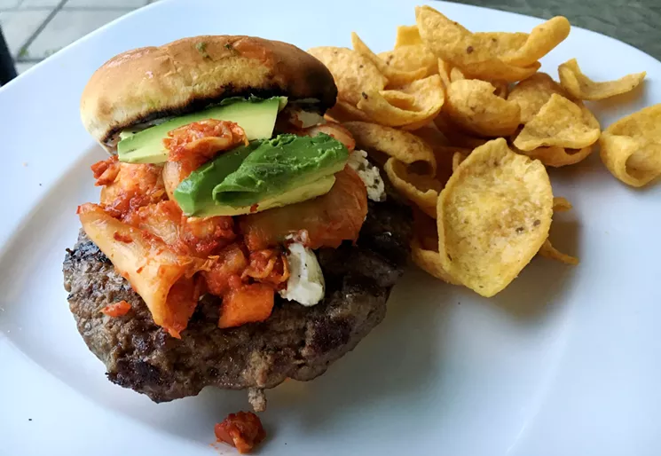 Once the kimchi was ready, I tested it on a burger, along with cream cheese and avocado. - MARK ANTONATION