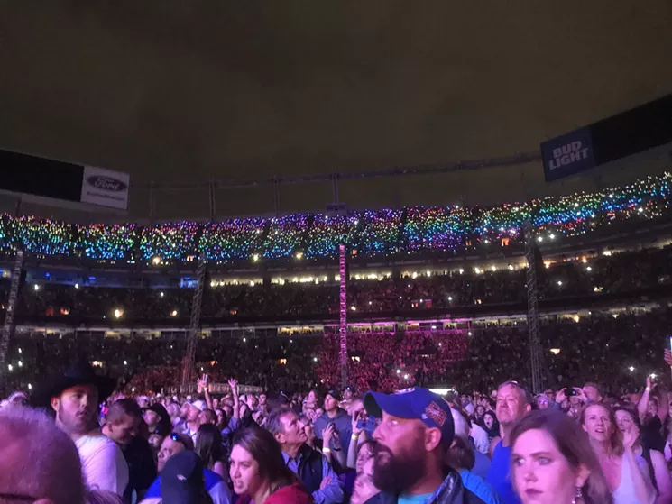 A rainbow flag created a halo over the crowd at the Garth Brooks concert on June 8, 2019 at Broncos Stadium. - KYLE HARRIS