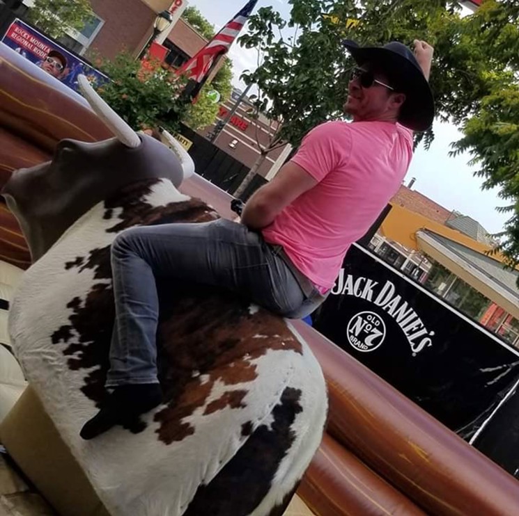 Owner Steven Alix took a ride on the bull at last year's rodeo. - CALEB ROTH