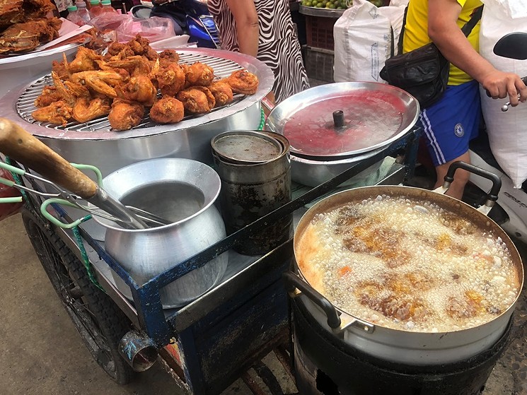 Eating street food outdoors is a way of life in Bangkok. - BEN WHELAN