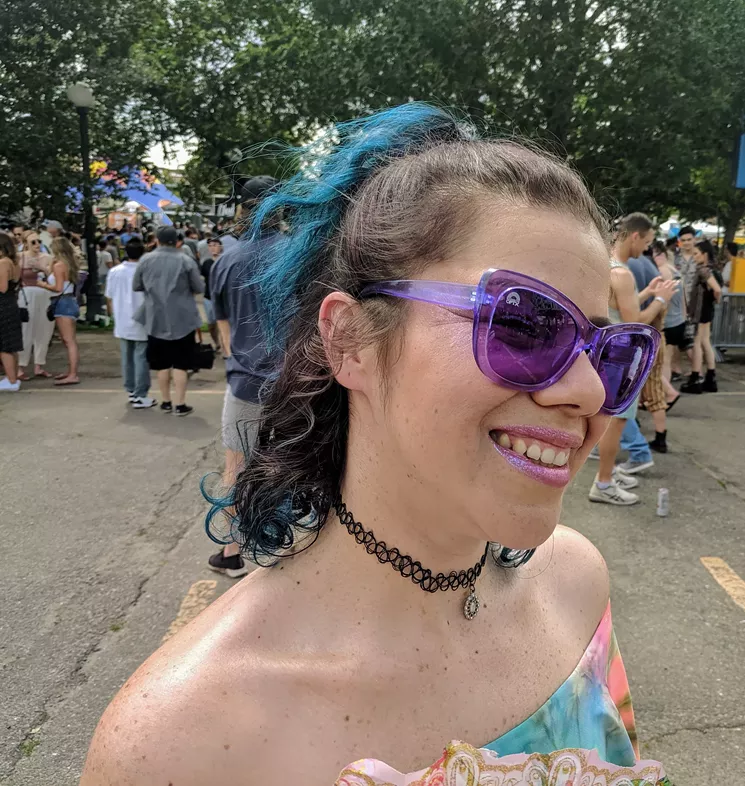 Gomez accessorizes with purple sunglasses, a black choker, and purple lip gloss. - PHOTO BY MAURICIO ROCHA