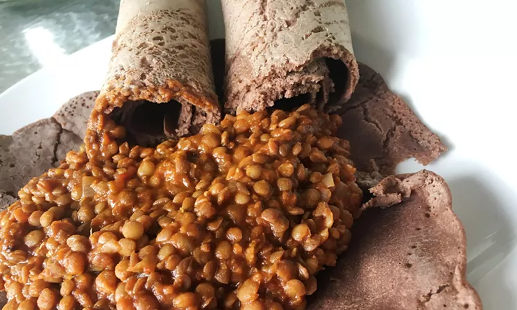 My homemade version of injera wasn't as pretty or spongy as chef Gebeye's, but my miser wot — a red lentil stew — was tasty. - MARK ANTONATION