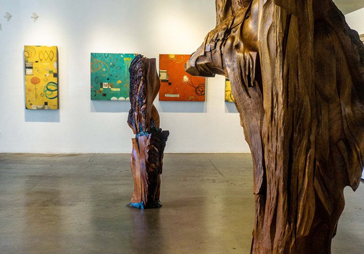 Don Quade's painting in the background with Norman Epp's sculptures in front. - COURTESY OF WALKER FINE ART