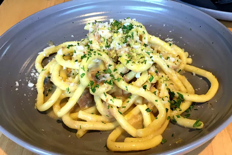 American Elm's carbonara uses housemade bucatini — like fat spaghetti with a hole in the middle. - MARK ANTONATION
