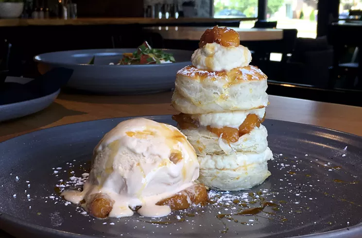 More seasonal produce appears in this peach Napoleon with bourbon-butterscotch ice cream and caramelized honey. - MARK ANTONATION