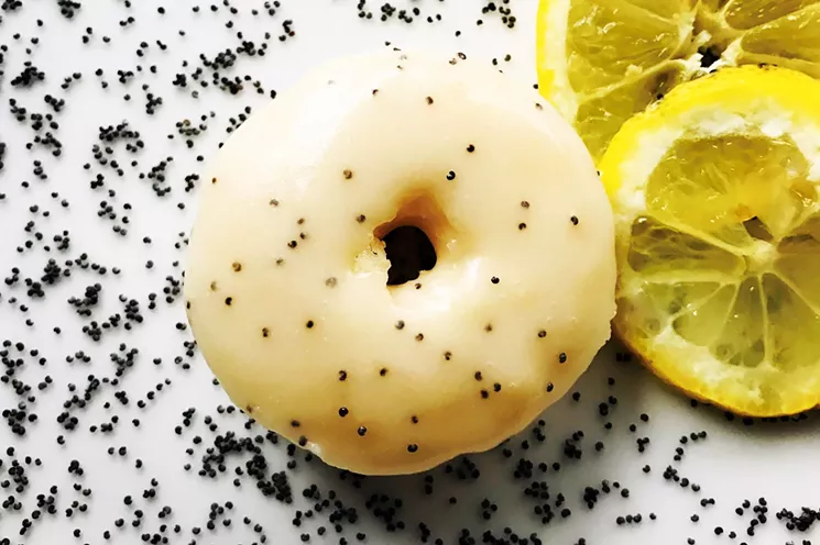 All of the doughnuts at Squeaky Little Wheel are free of eggs, dairy, animal products and artificial colors, including this lemon poppyseed version. - SQUEAKY LITTLE WHEEL