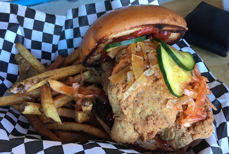 This Korean fried chicken sandwich with housemade kimchi is now sizzling at Little Beast. - MARK ANTONATION