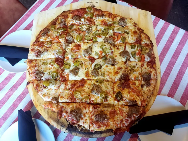 The Old Comiskey pie made with Stanislaus tomatoes, fresh and shredded mozzarella, giardiniera and fennel sausage at Grabowski's Pizzeria. - LINNEA COVINGTON