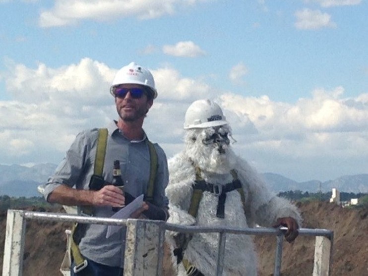Brian Dunn and the company's Yeti mascot at the groundbreaking in 2015. - JONATHAN SHIKES