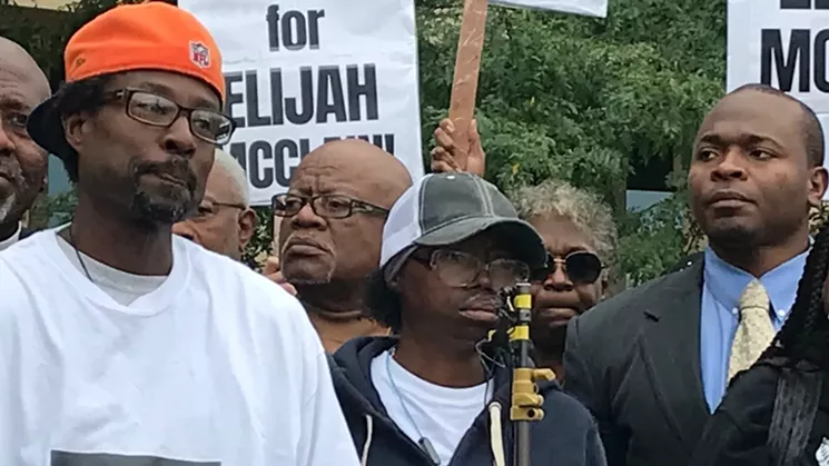 LaWayne Mosley, far left, and Sheneen McClain, center, spoke on behalf of their son, Elijah McClain. - MICHAEL ROBERTS